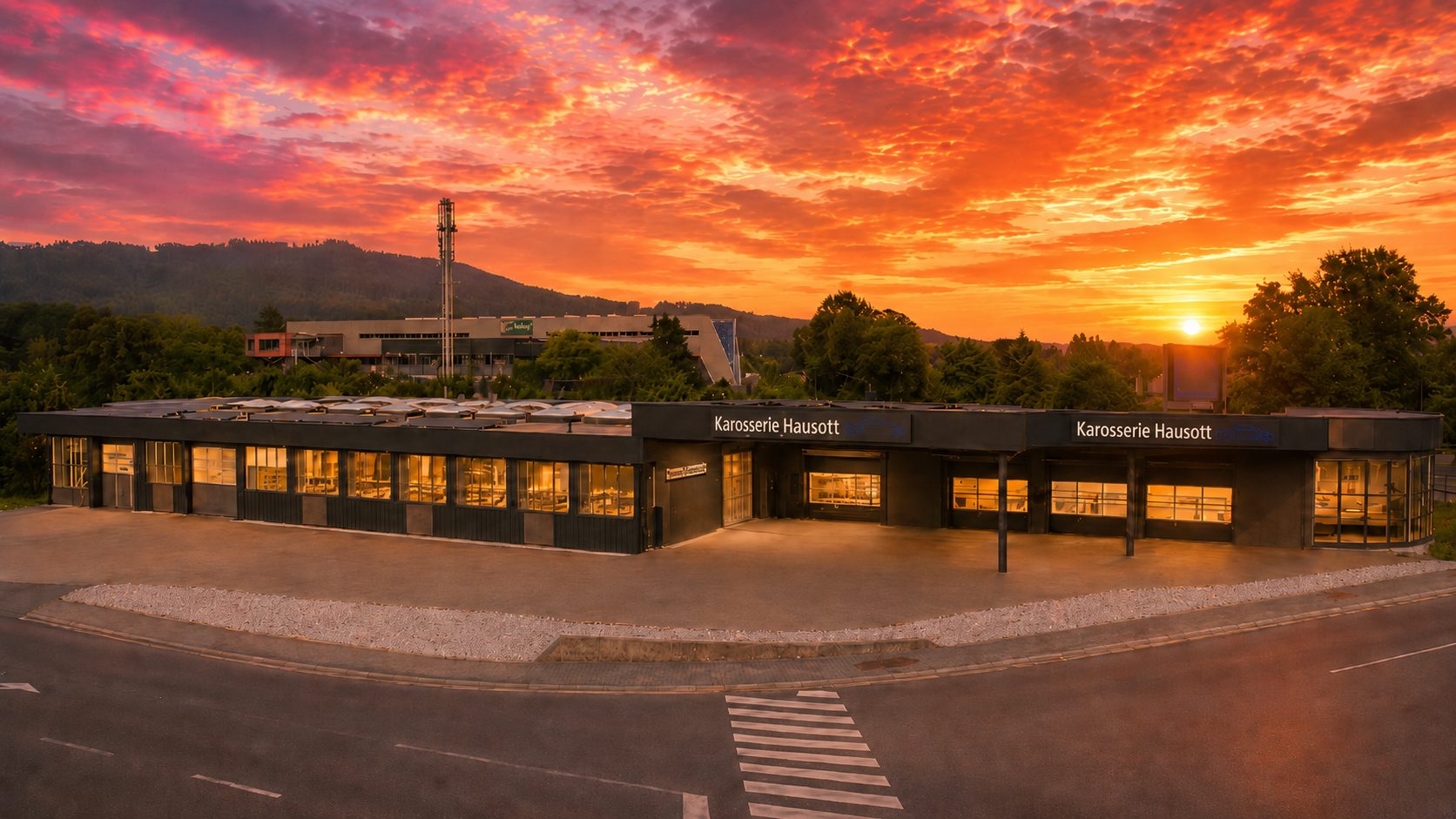 Karosserie Hausott in Villach-Landskron bei Sonnenuntergang